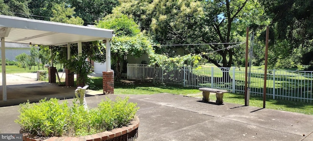 view of property's community featuring a carport and a lawn