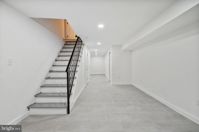 stairs with light tile flooring