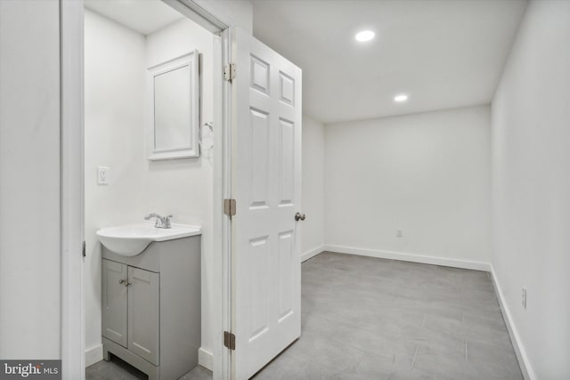 bathroom with vanity and tile floors