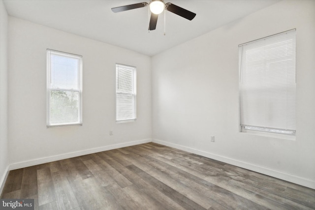 spare room featuring ceiling fan and hardwood / wood-style floors