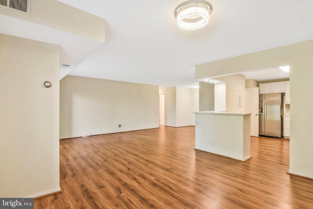 unfurnished living room featuring light hardwood / wood-style flooring