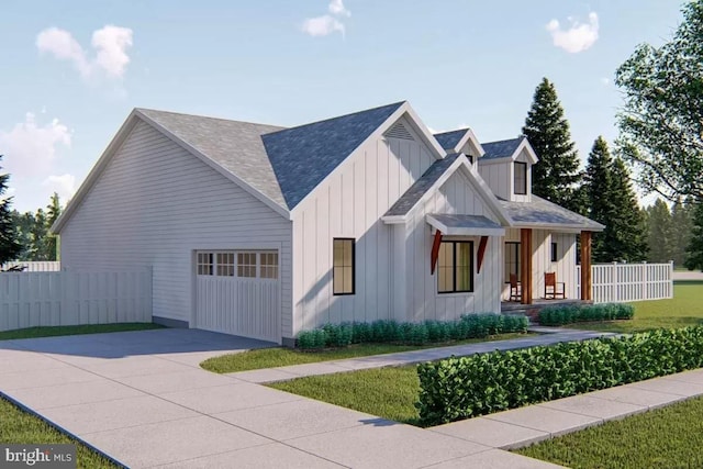 view of front of property featuring a garage and a front lawn