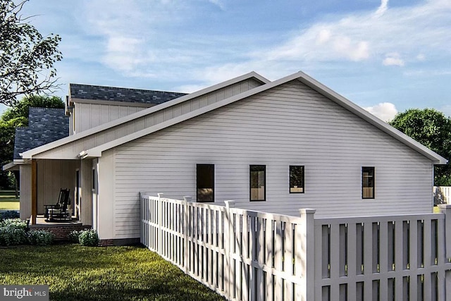 view of property exterior with a yard