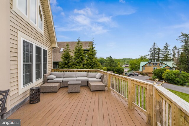 deck featuring outdoor lounge area