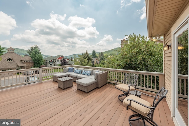 wooden deck with an outdoor hangout area