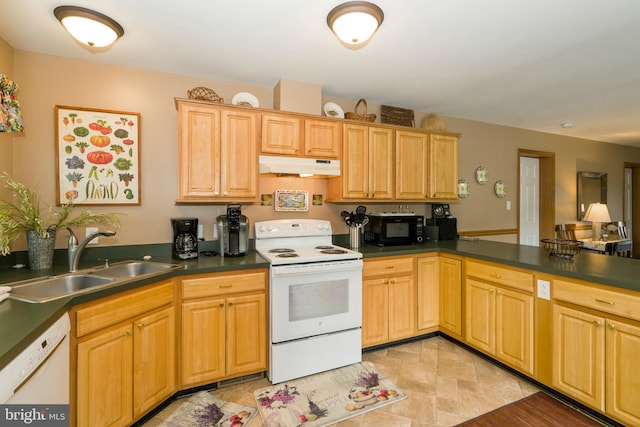 kitchen with sink, light tile flooring, and white appliances