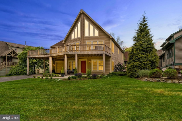 view of front of property featuring a front lawn and a wooden deck