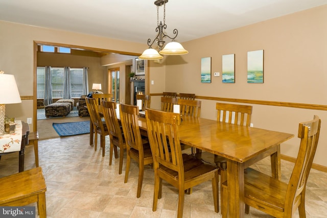 dining space with light tile floors