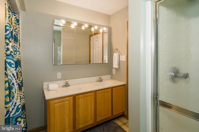 bathroom featuring double sink vanity and tile floors