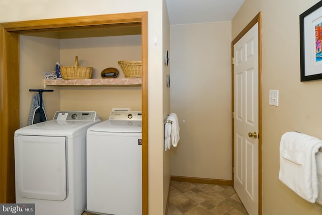 laundry area featuring tile flooring and washing machine and clothes dryer