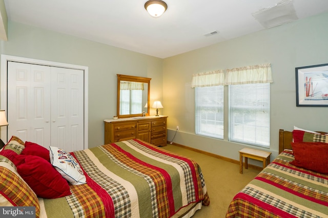 carpeted bedroom featuring a closet