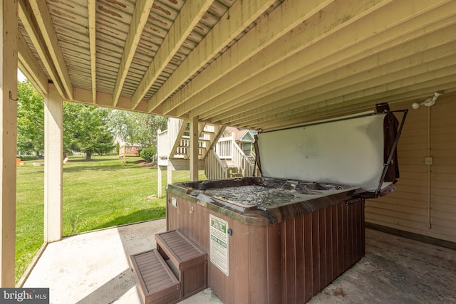 view of terrace with a hot tub