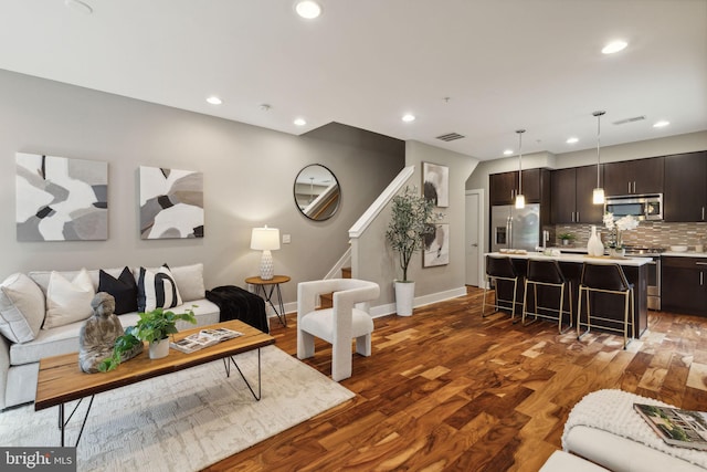 living room featuring dark wood-type flooring