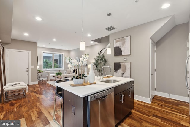 kitchen featuring sink, stainless steel dishwasher, dark hardwood / wood-style floors, dark brown cabinets, and a center island with sink