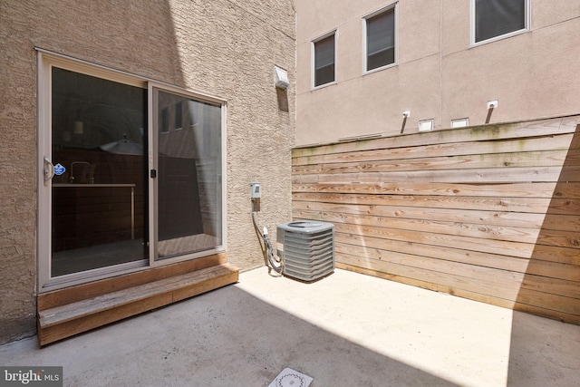 view of patio with central AC unit