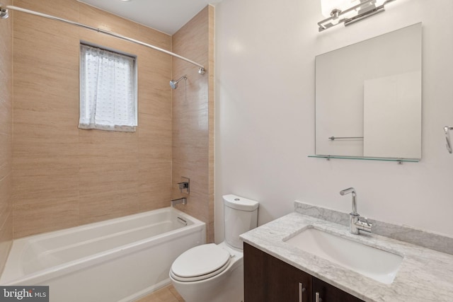 full bathroom with vanity, tiled shower / bath combo, and toilet