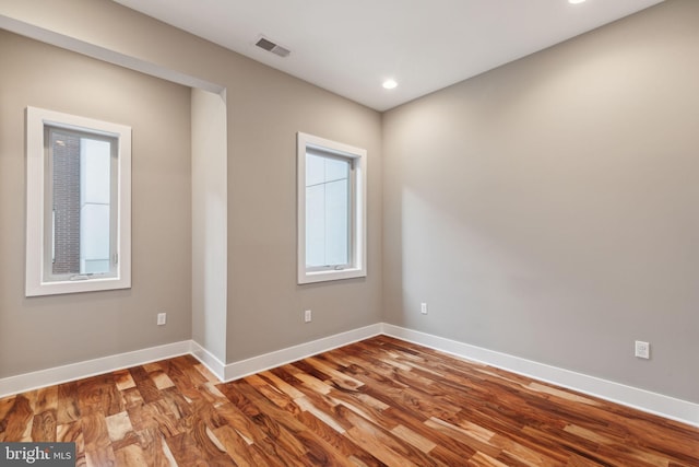 spare room with hardwood / wood-style flooring