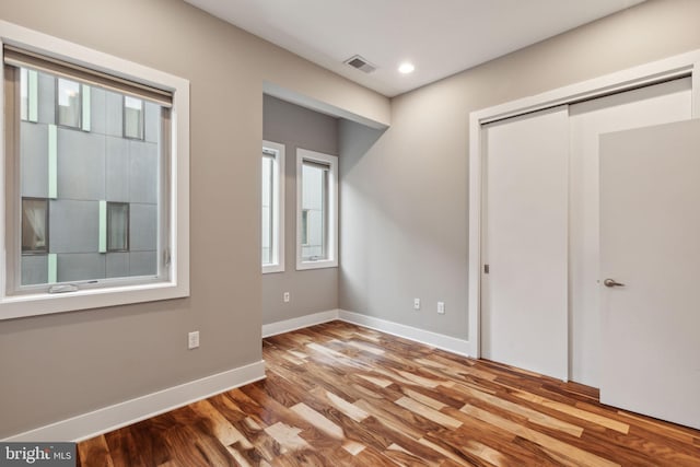 unfurnished bedroom with light hardwood / wood-style floors