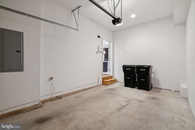 garage featuring a garage door opener and electric panel