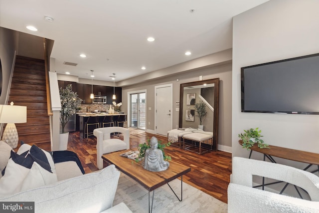 living room with dark hardwood / wood-style floors