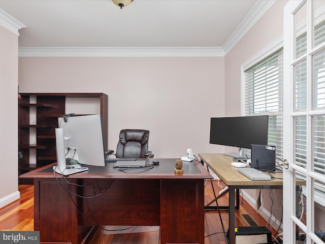 home office featuring ornamental molding and light hardwood / wood-style flooring