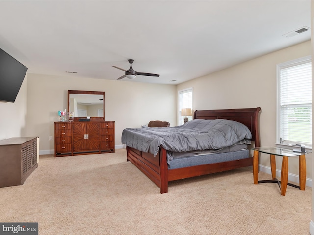 bedroom with ceiling fan and carpet flooring