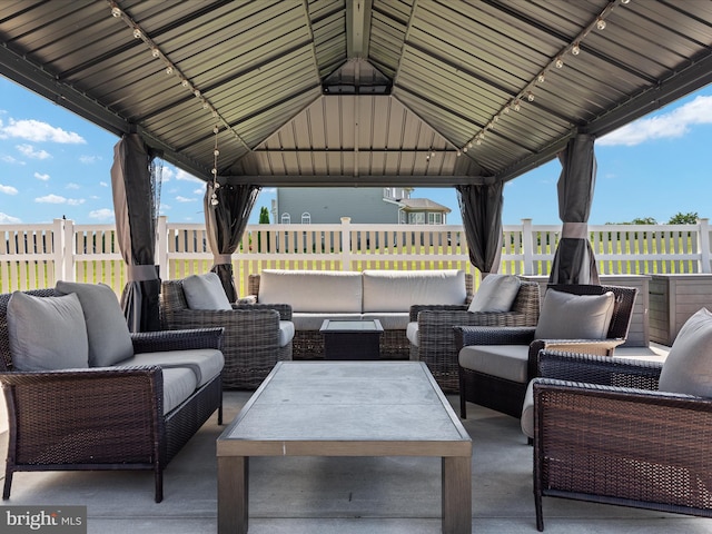 view of patio with an outdoor hangout area and a gazebo