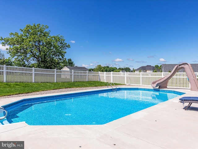 view of pool featuring a water slide