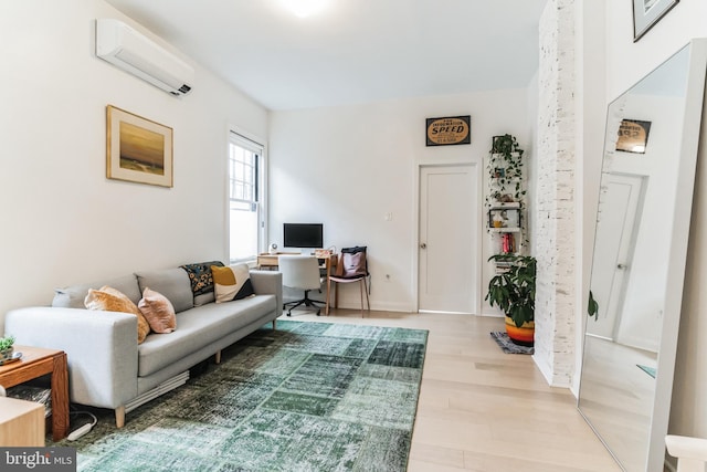 living room with an AC wall unit and hardwood / wood-style flooring