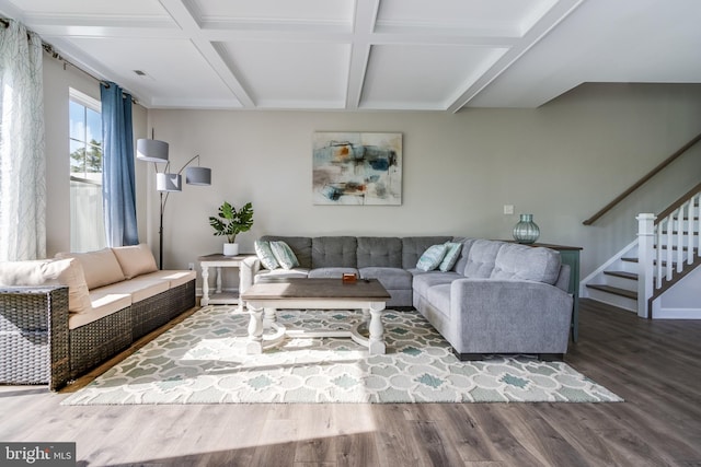 living room with beam ceiling, coffered ceiling, and hardwood / wood-style floors