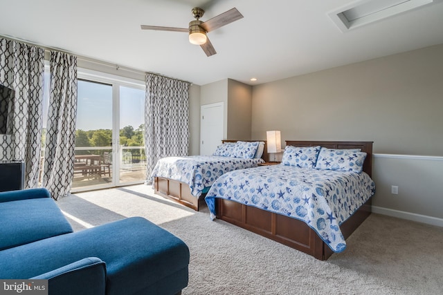 carpeted bedroom featuring ceiling fan and access to exterior