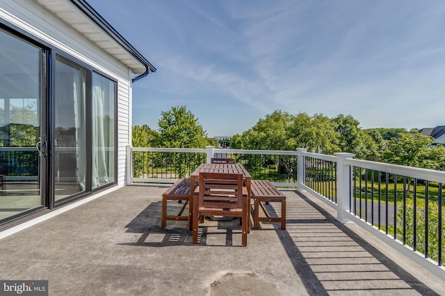 view of patio featuring a balcony