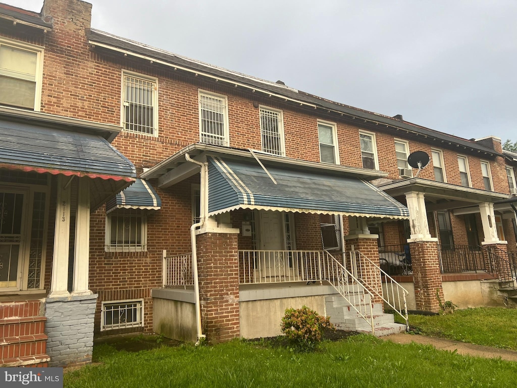 townhome / multi-family property with covered porch