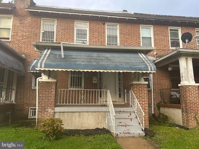 view of property with a porch