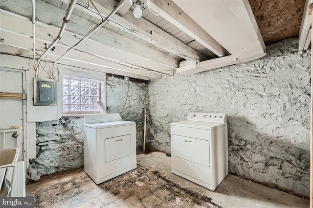 clothes washing area featuring washer and clothes dryer