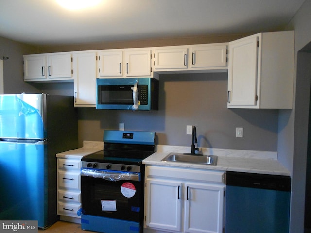 kitchen featuring white cabinetry, sink, and stainless steel appliances