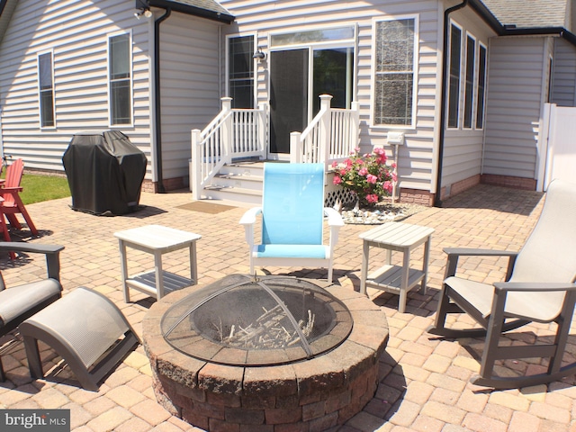 view of patio featuring a fire pit and area for grilling