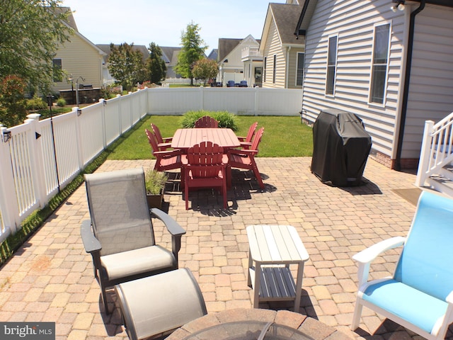 view of patio featuring a grill