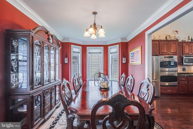 dining space featuring a notable chandelier, ornamental molding, and dark hardwood / wood-style flooring