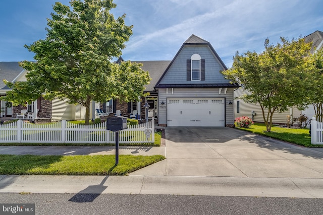 view of front of house featuring a front yard and a garage