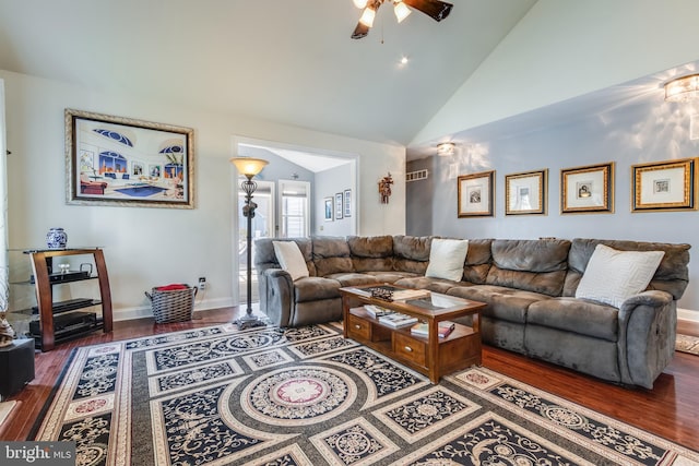 living room with high vaulted ceiling, ceiling fan, and hardwood / wood-style flooring