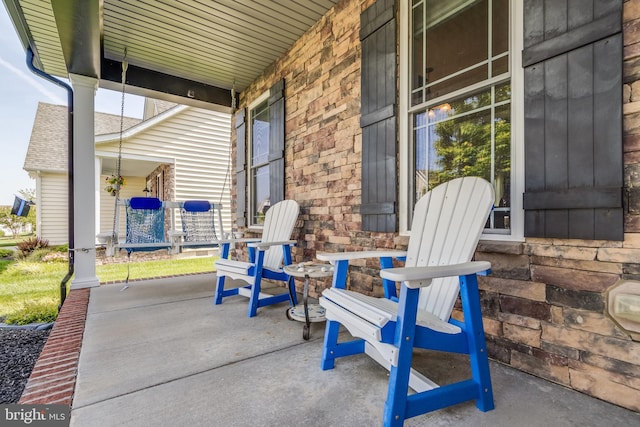 view of patio featuring covered porch