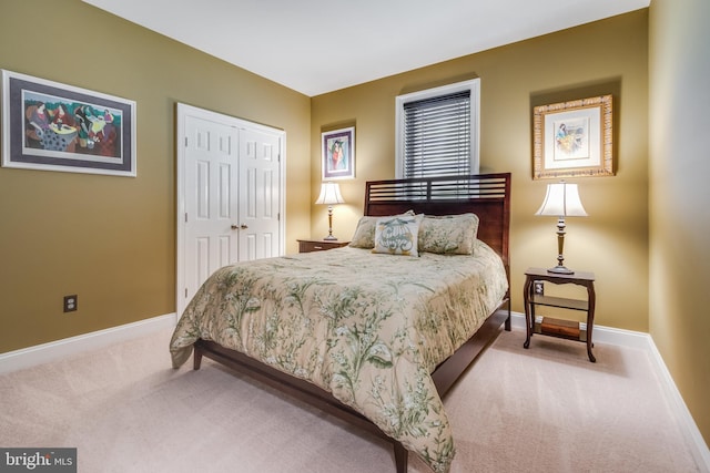 carpeted bedroom with a closet