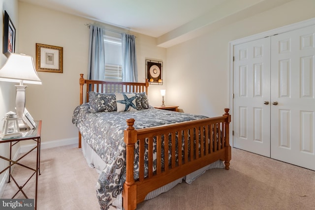 carpeted bedroom with a closet