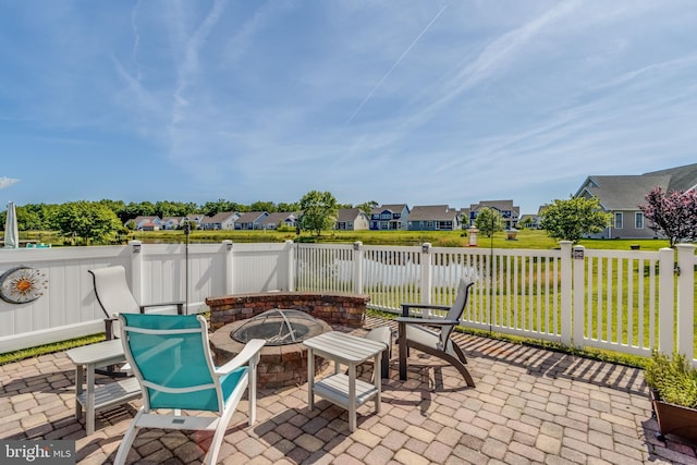 view of patio with a fire pit