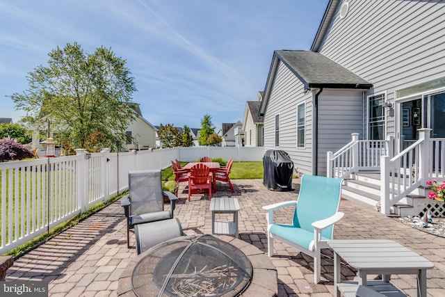 view of terrace with a fire pit