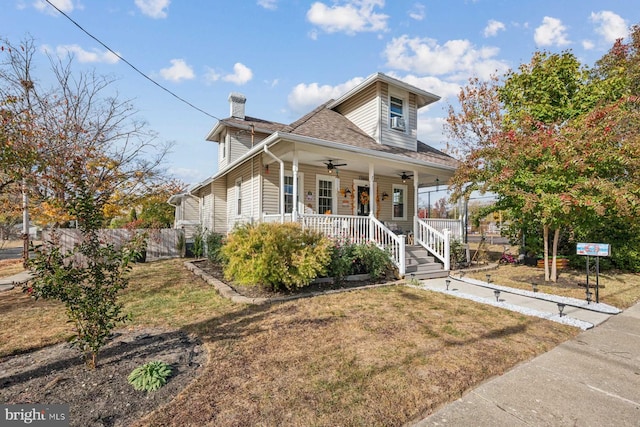 view of front facade with a front lawn and a porch