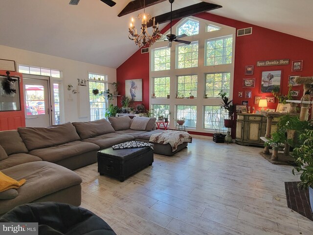 living room with ceiling fan with notable chandelier, beam ceiling, light wood-type flooring, and high vaulted ceiling