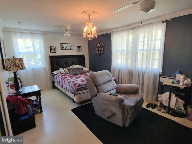 bedroom featuring crown molding and a chandelier