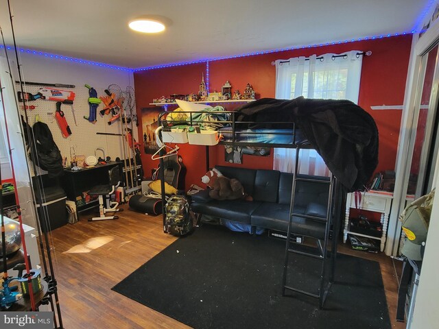 bedroom featuring a workshop area and hardwood / wood-style flooring